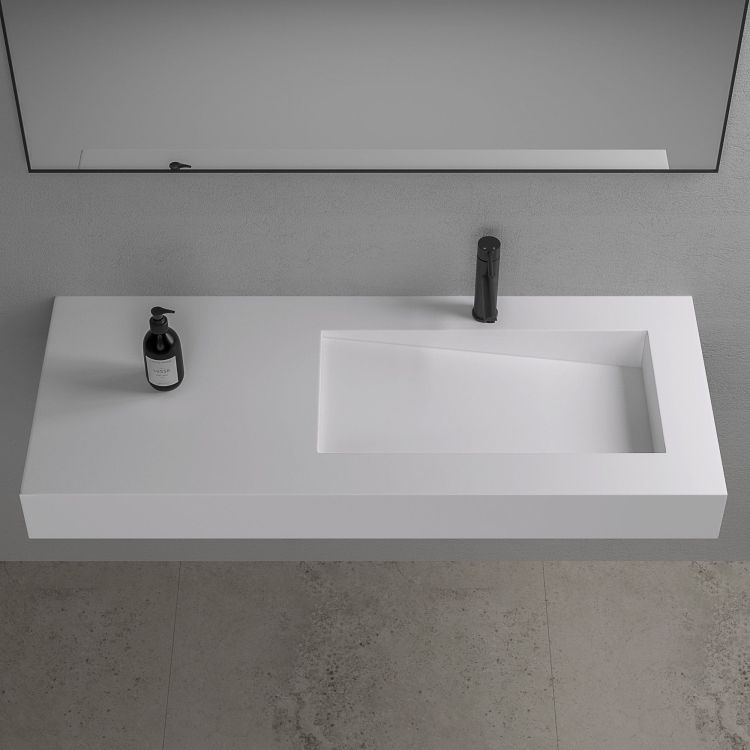 Asymetryczna umywalka na indywidualny wymiar z materiałów Solid Surface z misą Slide 66x30SOL
